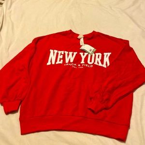 Bright red H&M crewneck with white accent letters